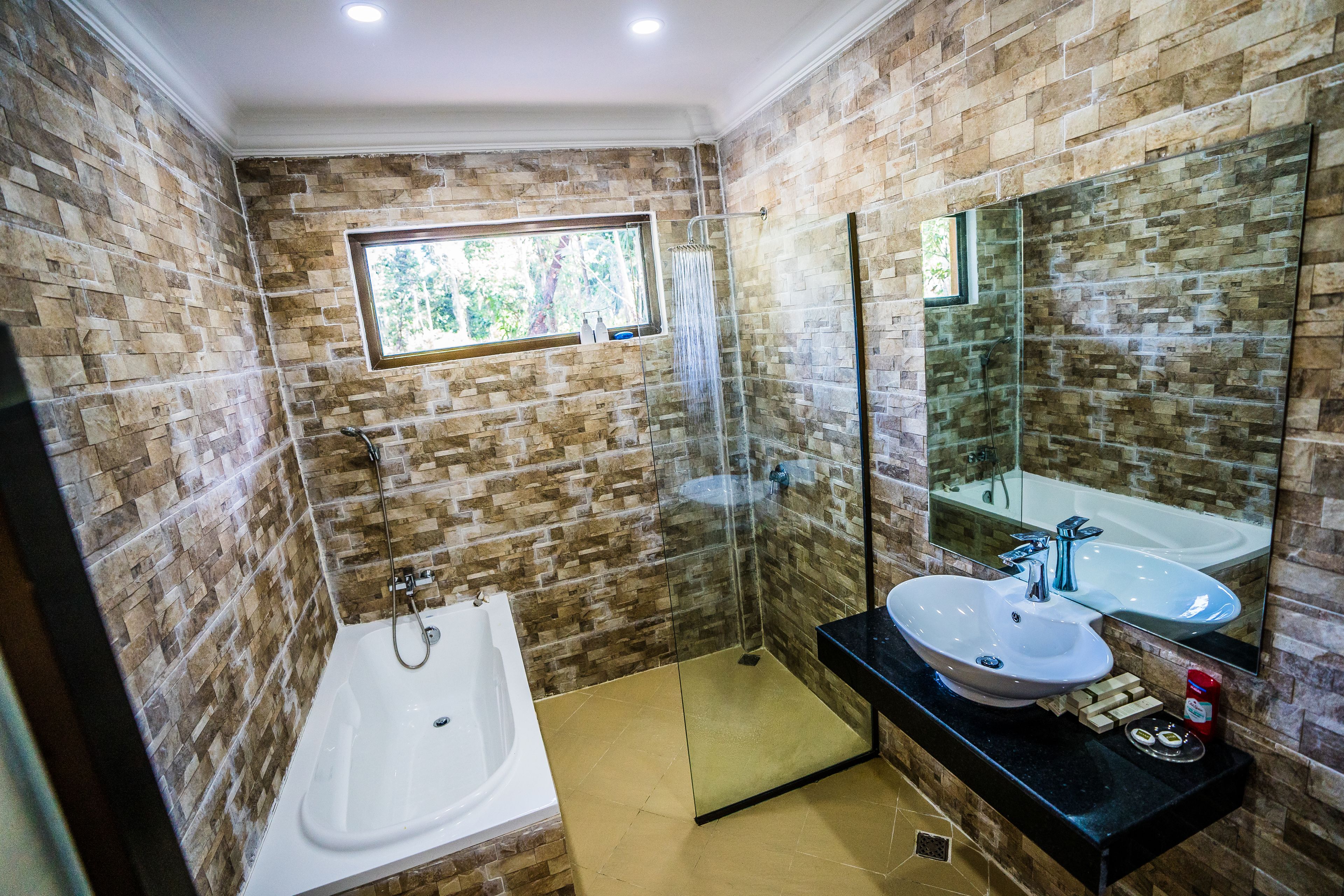 vacation home | bathroom | combined shower/bathtub, deep-soaking bathtub, rainfall showerhead