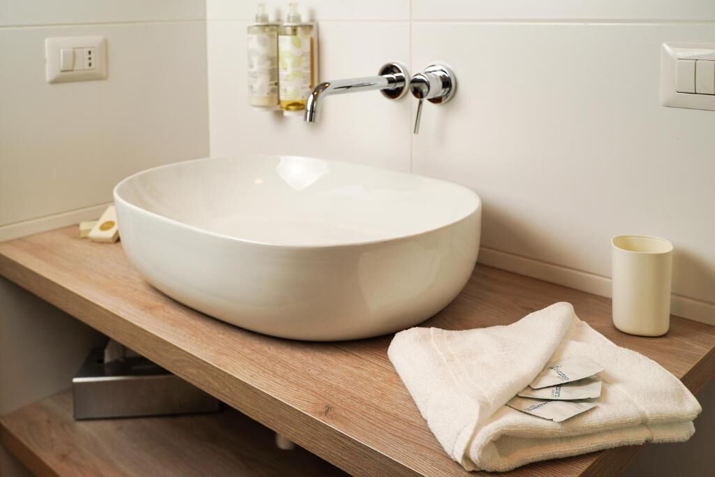 deep-soaking bathtub, rainfall showerhead, free toiletries, hair dryer