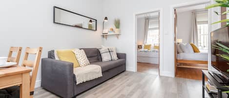 32-inch flat-screen TV with cable channels, LED TV