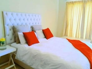 Individually furnished, desk, laptop workspace, iron/ironing board