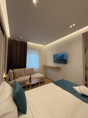 Shower, designer toiletries, hair dryer, towels