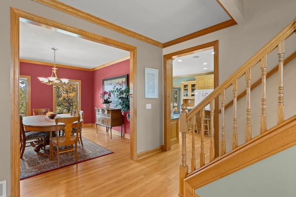 View of the formal dining room with stairs to 2nd floor. Roomy open floor plan.