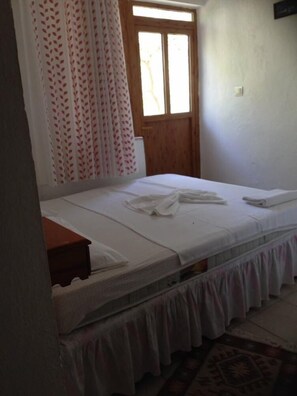 Minibar, desk, bed sheets