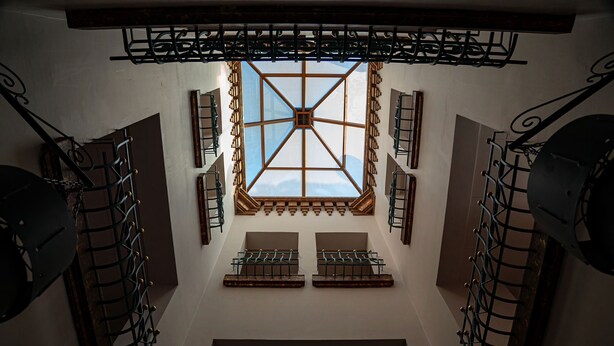 A staircase with a skylight, metal railings, and a view of the sky. - Guest House Amman (Amman)