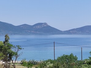 A coastal landscape with a clear view of the sea and distant mountains. - Agiokampos Luxurious Resort (Istiaia-Aidipsos)