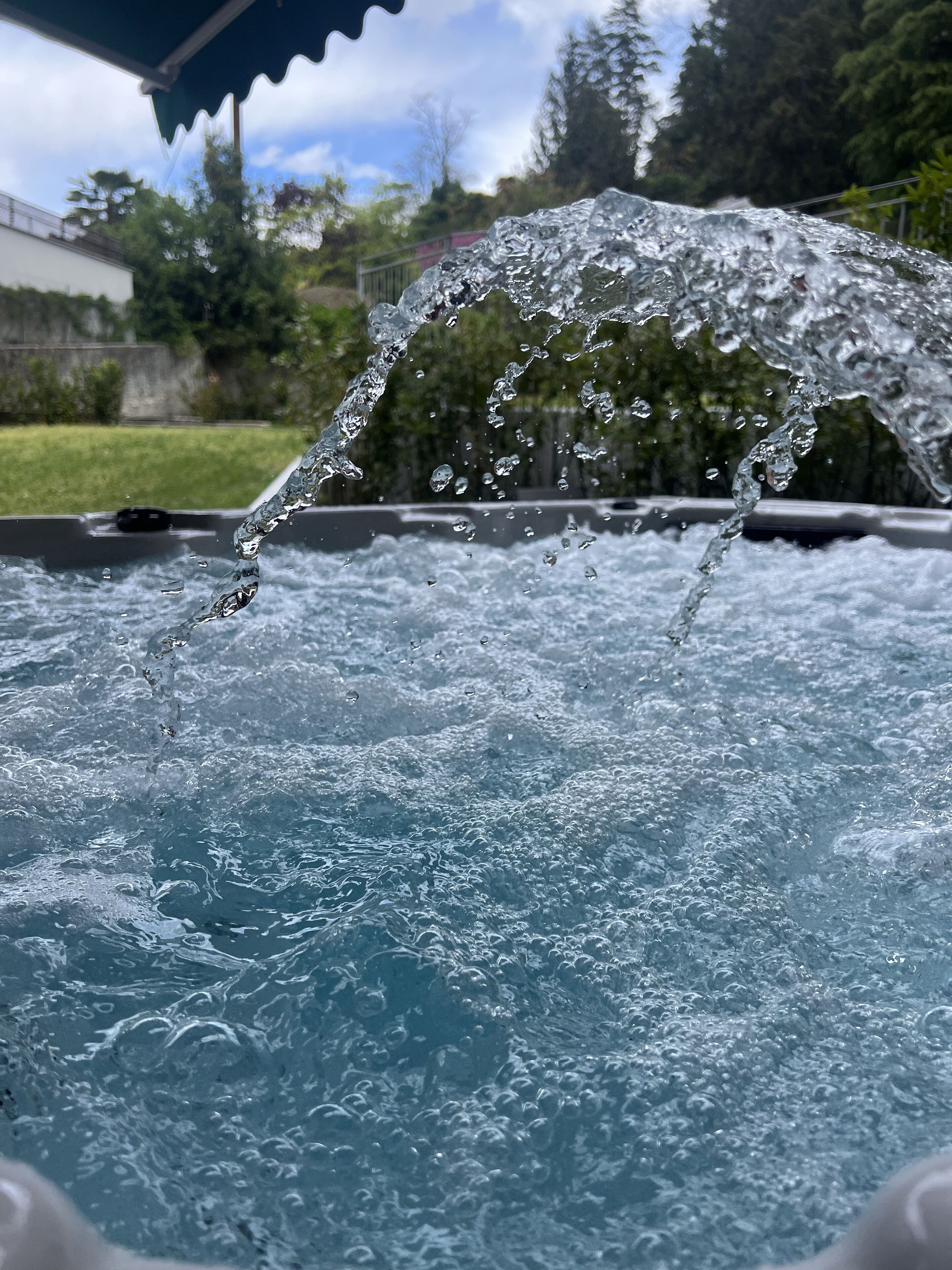 A hot tub with water splashing out.