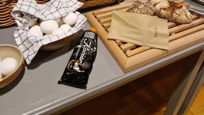 A breakfast buffet with various breads, pastries, eggs, and condiments. - Kroppefjäll Bed & Breakfast (Dals Rostock)