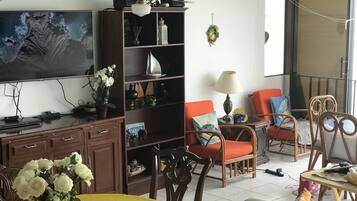 Family Apartment, 3 Bedrooms, Connecting Rooms, Ocean View | Living area | Flat-screen TV