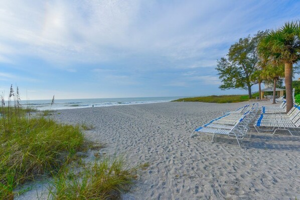 On the beach, sun loungers, beach towels