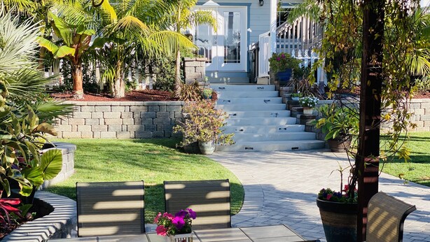 A patio with outdoor seating and a stone staircase leading to a house. - Quaint and Charming 2 bd, 1 bath,  Central Location, easily accessible! (San Diego)