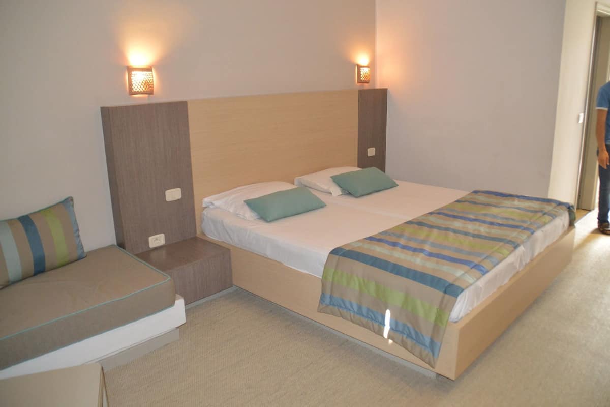 Family Quadruple Room, Non Smoking, Pool View | 1 bilik tidur, meja, langsir/tirai gelap terus, seterika/papan seterika