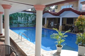 Outdoor pool, open 6 AM to 10 PM, sun loungers
