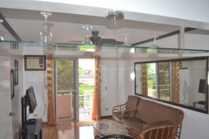 Deluxe Apartment, 1 Bedroom | Living area | 32-inch flat-screen TV with cable channels, TV - Villa Prescilla (Dumaguete)