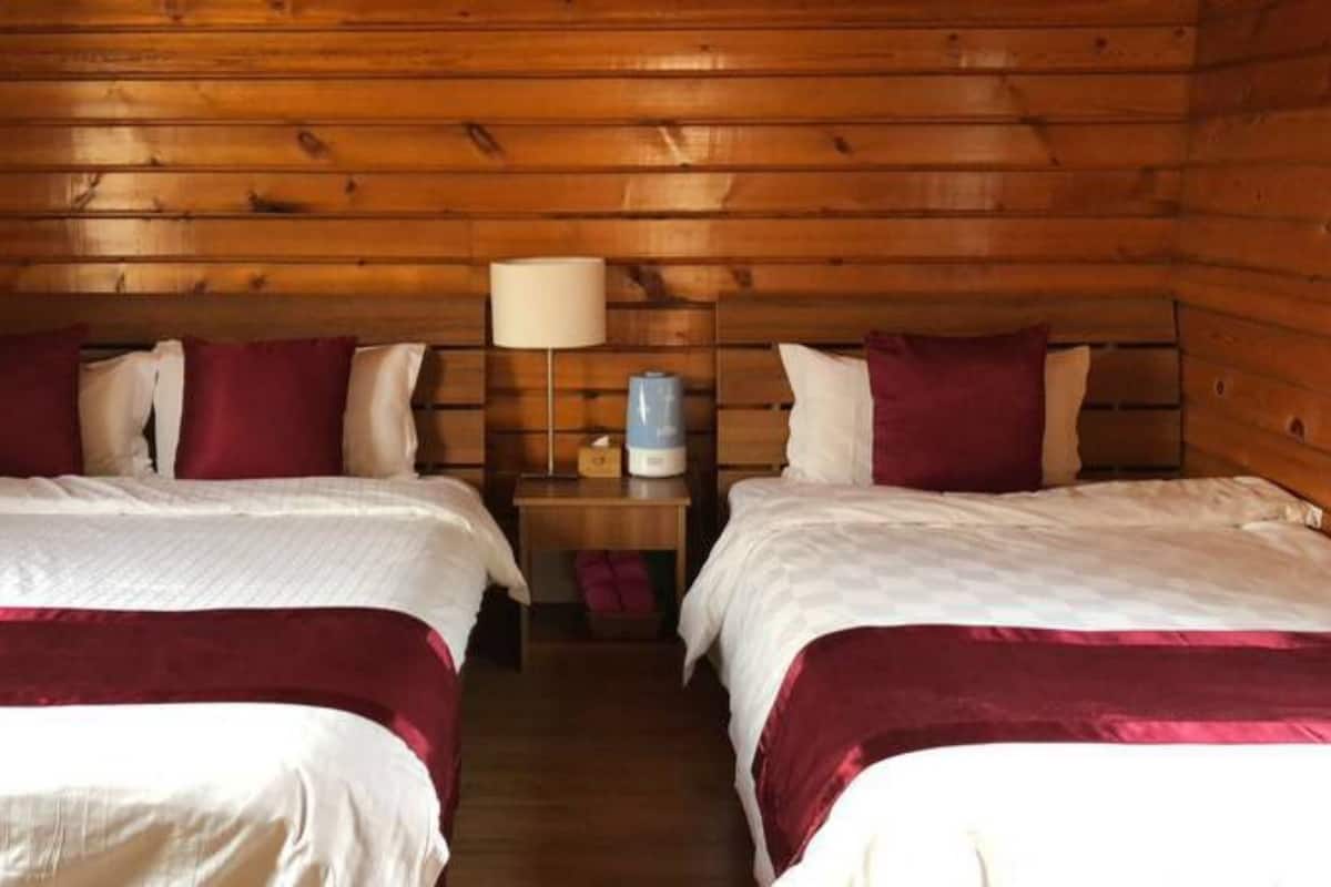 Signature Chalet, 1 Bedroom, Courtyard Area | Desk, blackout drapes, soundproofing, iron/ironing board