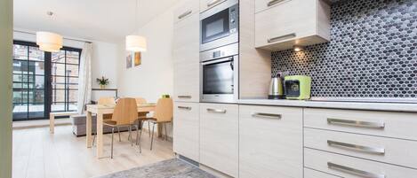 Deluxe Suite, 1 Bedroom, Courtyard Area (Lubicz 17 Street) | Private kitchen | Fridge, oven, stovetop, dishwasher