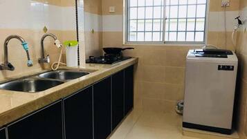 Apartment, 3 Bedrooms | Private kitchen | Full-sized fridge, microwave, stovetop, electric kettle