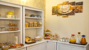 A breakfast buffet with various food items and beverages.