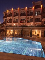 Seasonal outdoor pool, open 8 AM to 8 PM, free cabanas, pool umbrellas