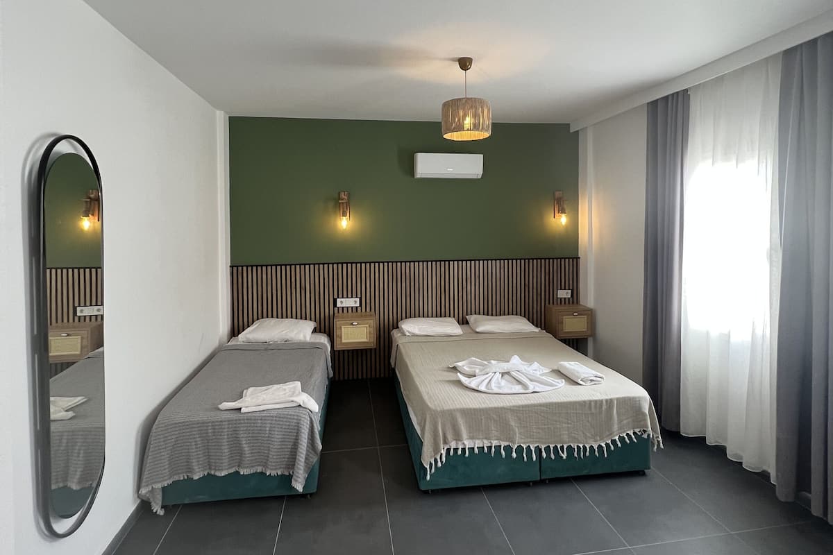 Family Triple Room | Minibar, desk, blackout drapes, free WiFi