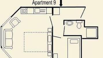 Plano de planta del Apartamento 9, que incluye un salón, cocina y un baño pequeño.