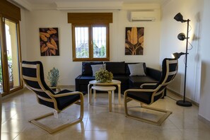 TV, fireplace, books