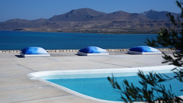Outdoor pool, open 11:00 AM to 8:00 PM, pool loungers