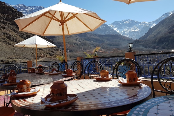 Breakfast, lunch, dinner served; local cuisine, garden views