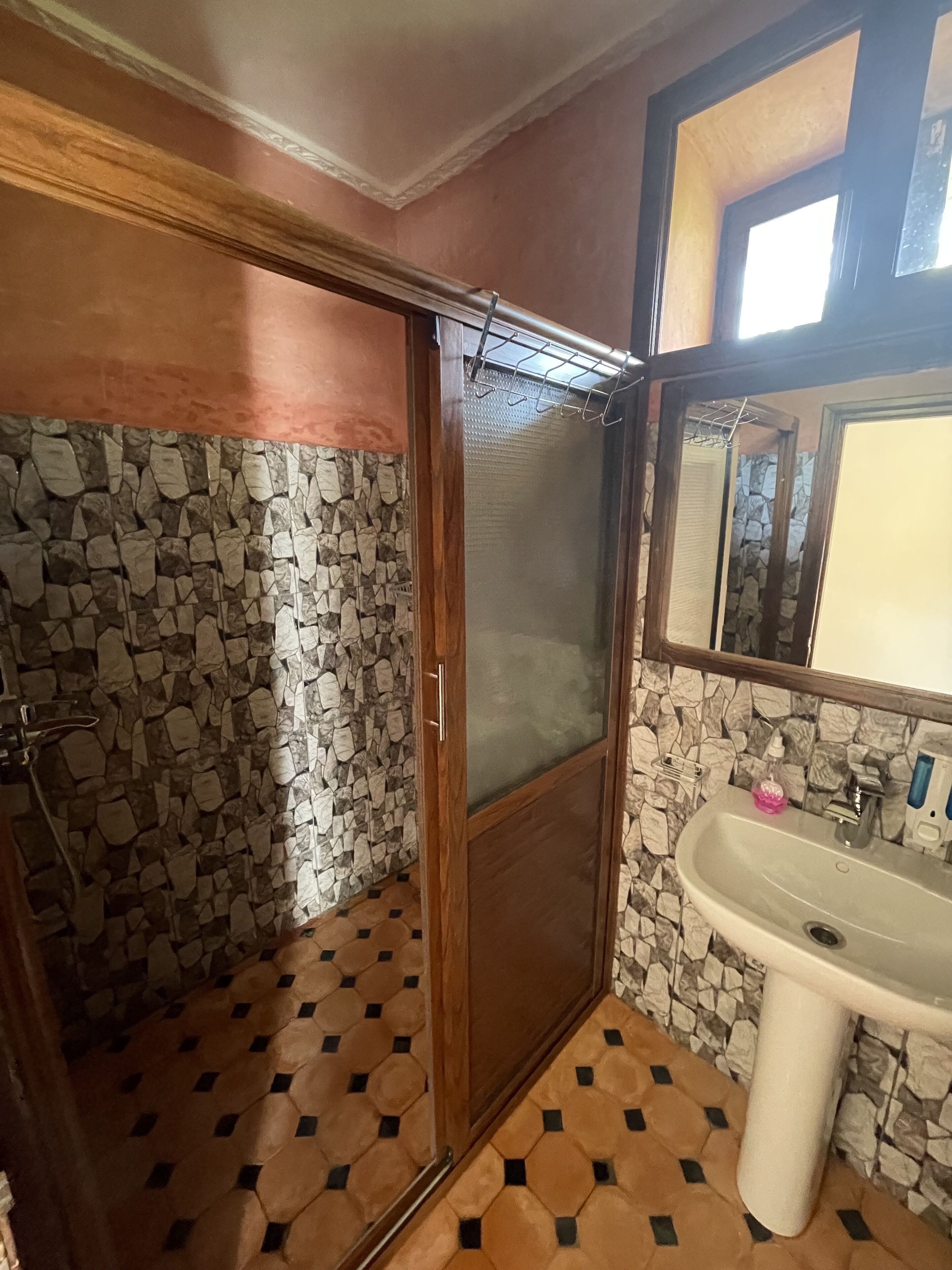 panoramic family room, balcony, mountain view | bathroom | shower, hair dryer, bathrobes, slippers