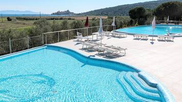 Seasonal outdoor pool, pool umbrellas, pool loungers