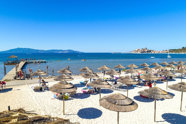 On the beach, sun loungers, beach umbrellas