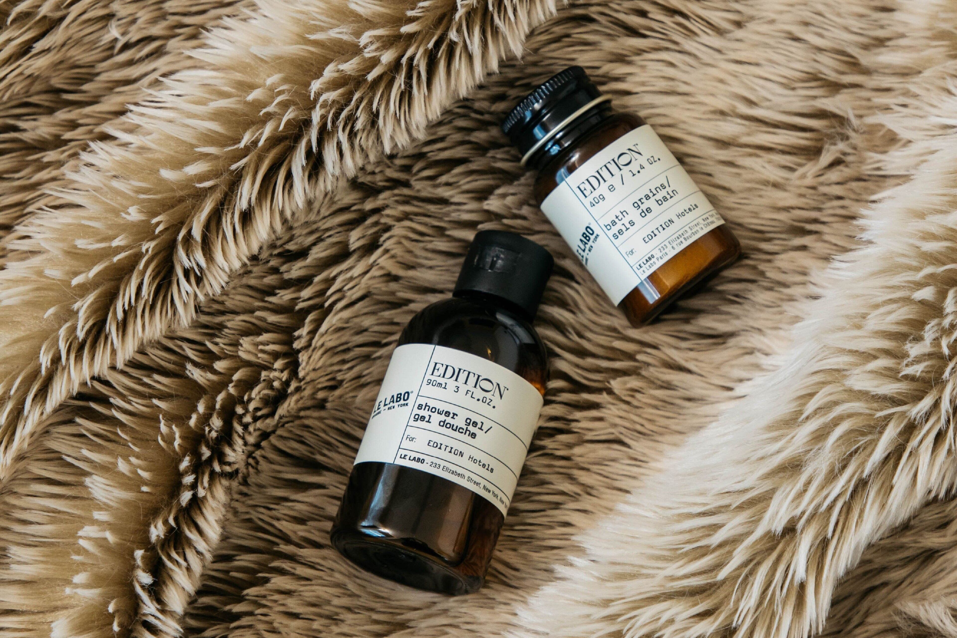 designer toiletries, hair dryer, bathrobes, slippers