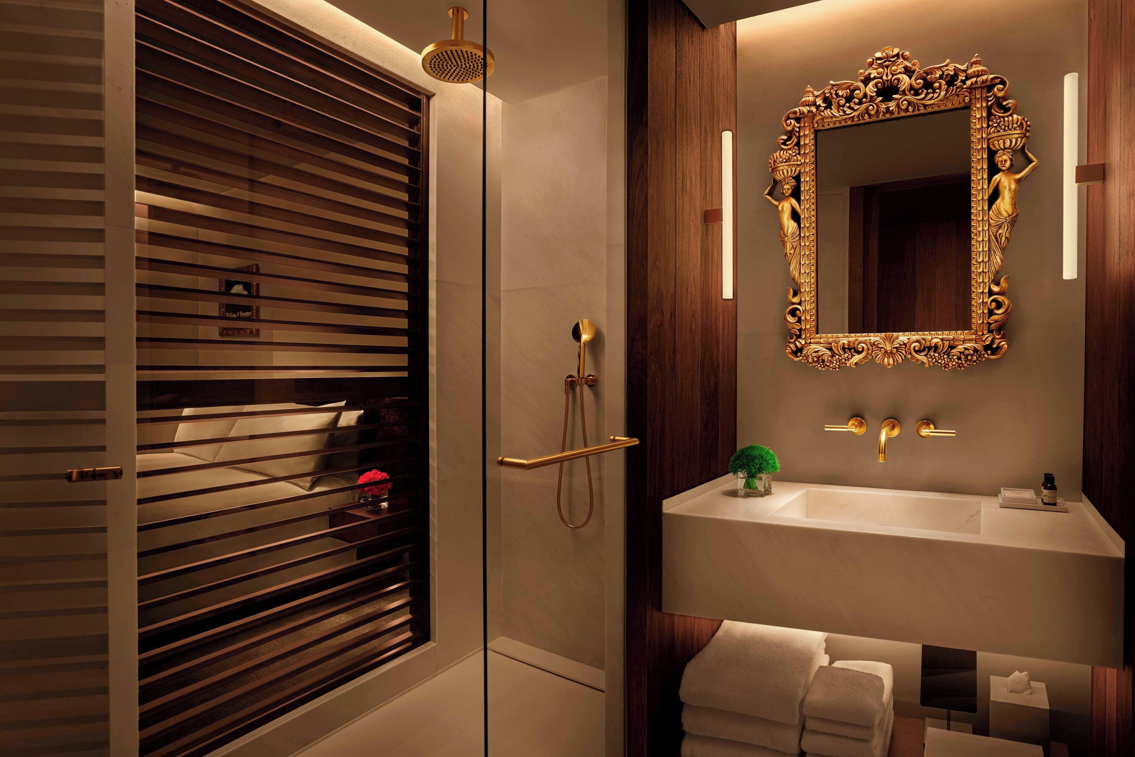 designer toiletries, hair dryer, bathrobes, slippers