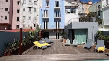 Outdoor pool, open 9:00 AM to 8:00 PM, pool umbrellas, pool loungers