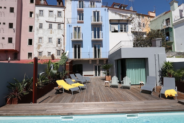 Outdoor pool, open 9:00 AM to 8:00 PM, pool umbrellas, pool loungers