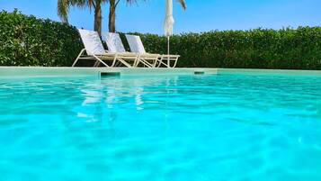 Seasonal outdoor pool, open 9:00 AM to 7:30 PM, sun loungers