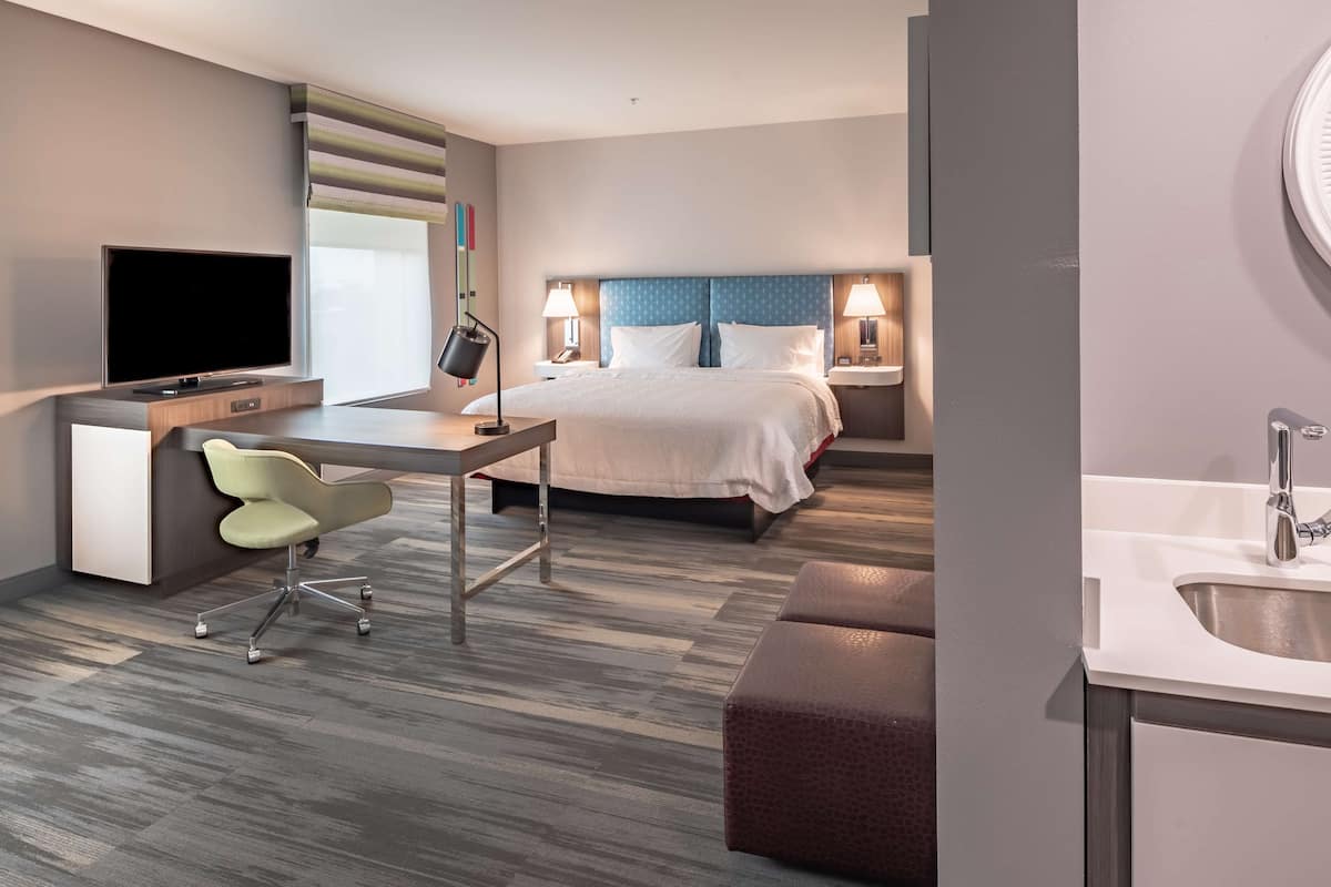 Suite, 1 King Bed, Accessible, Refrigerator & Microwave (Hearing) | In-room safe, desk, laptop workspace, free cribs/infant beds