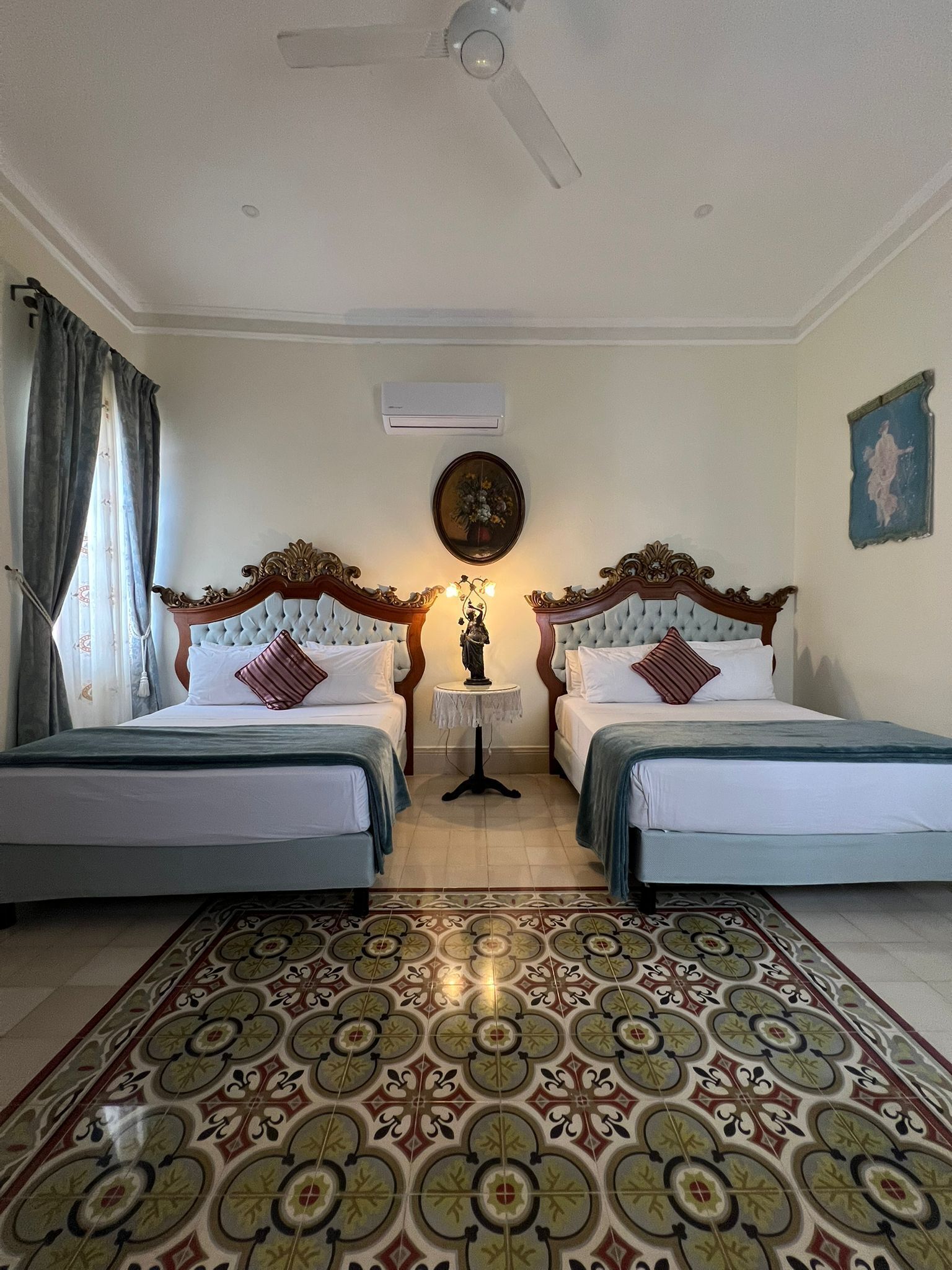 Deluxe Quadruple Room, 2 Queen Beds | In-room safe, individually decorated, individually furnished, desk