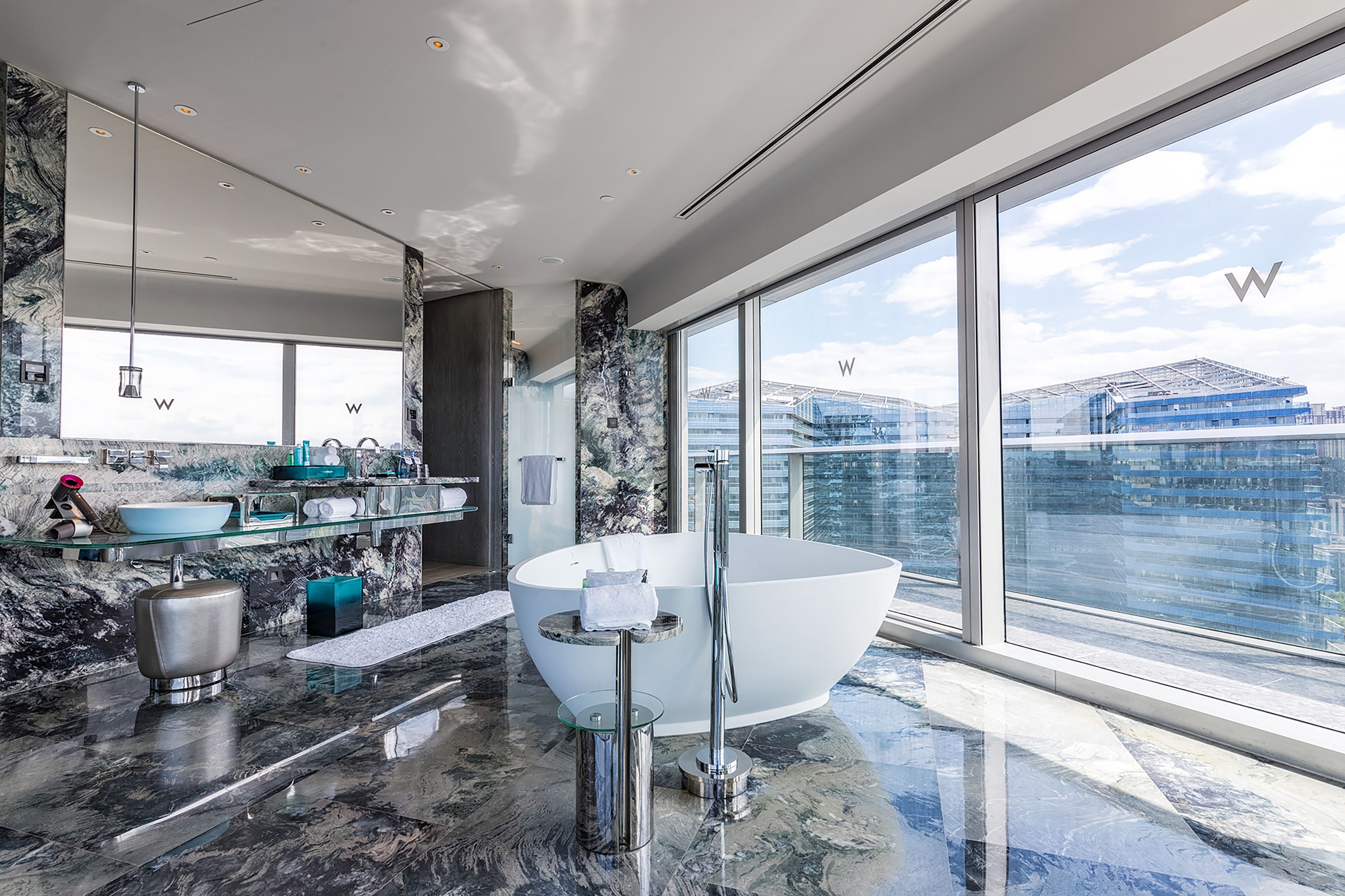 designer toiletries, hair dryer, bathrobes, slippers