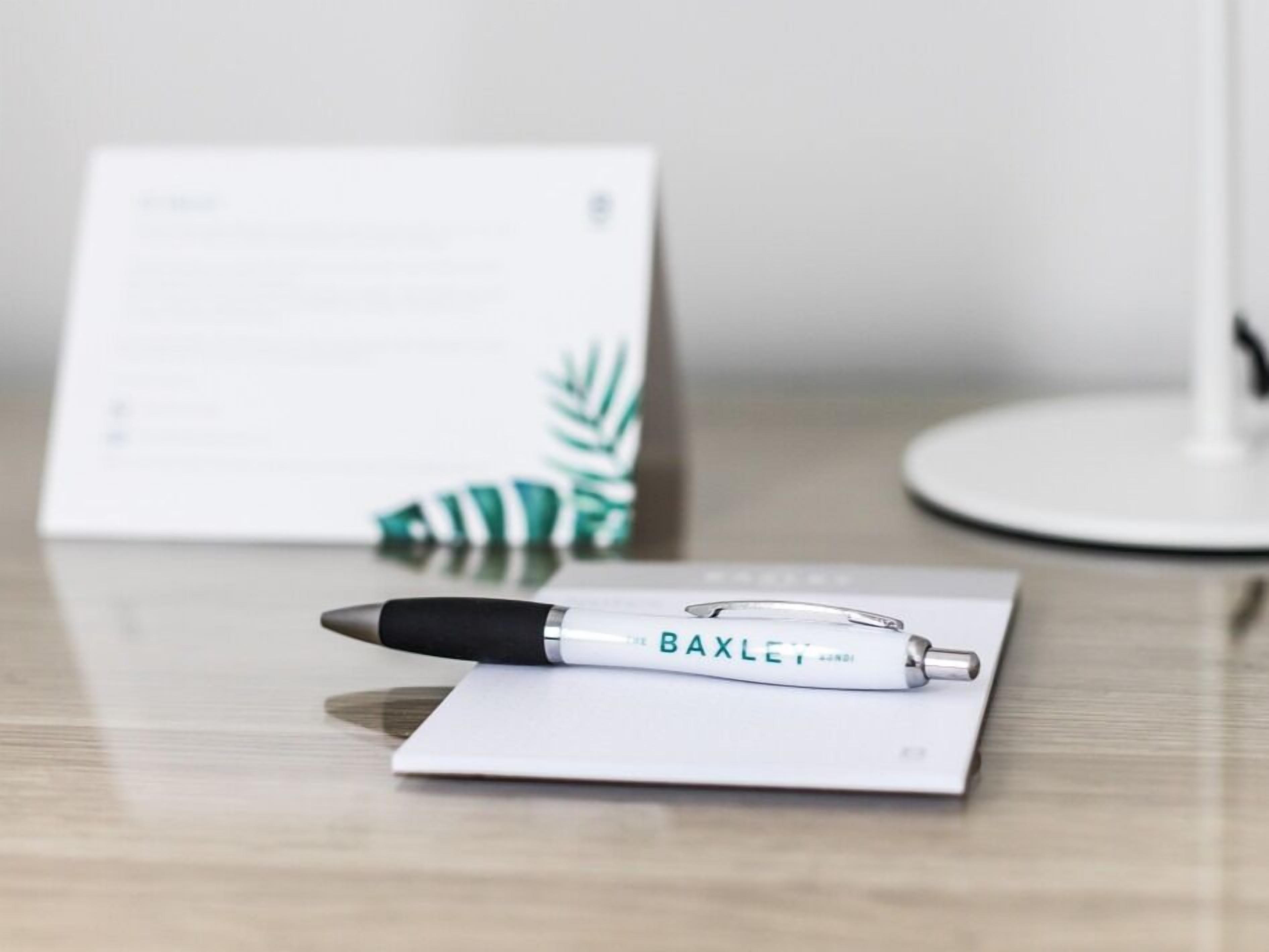 A pen on a white surface with a document in the background.