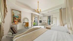 A hotel room with two beds, a large painting, a chandelier, and a view of the outdoors. - Pass Happiness On (Wujie)