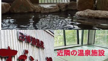 A hot spring area with a wooden deck and a stone-lined pool.