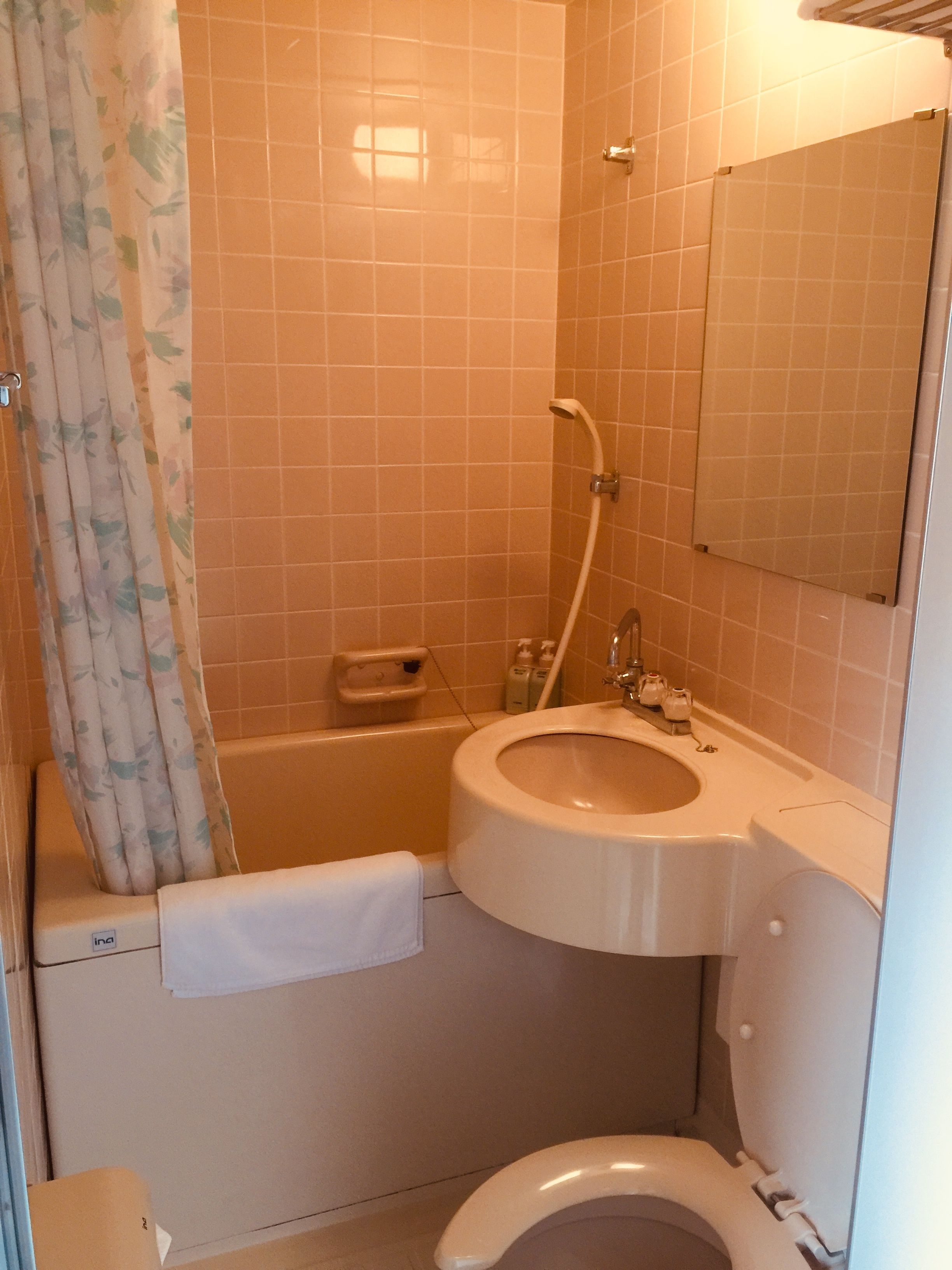 A bathroom with a bathtub, sink, and toilet.