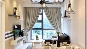 A modern dining area with a large window, two pendant lights, and a dining table set for four. - The Robertson 1 Bedroom Bukit Bintang KL (Kuala Lumpur)