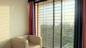 Deluxe Double Room | Living area | Flat-screen TV