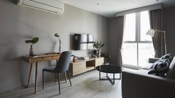 Suite, 2 Bedrooms | Living area | 42-inch flat-screen TV with cable channels, TV