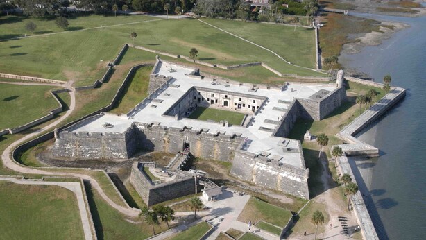 An aerial view of a historic fort with a central courtyard, surrounded by walls and a moat. - Location Anastasia Island home, Bring your bikes! (St Augustine)