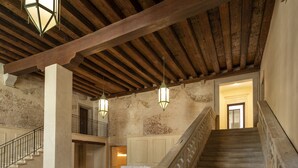 A spacious lobby with a checkered floor, a staircase, and hanging lanterns. - Palazzo Vendramin-Costa  Artist Studio-Loft (Venice)