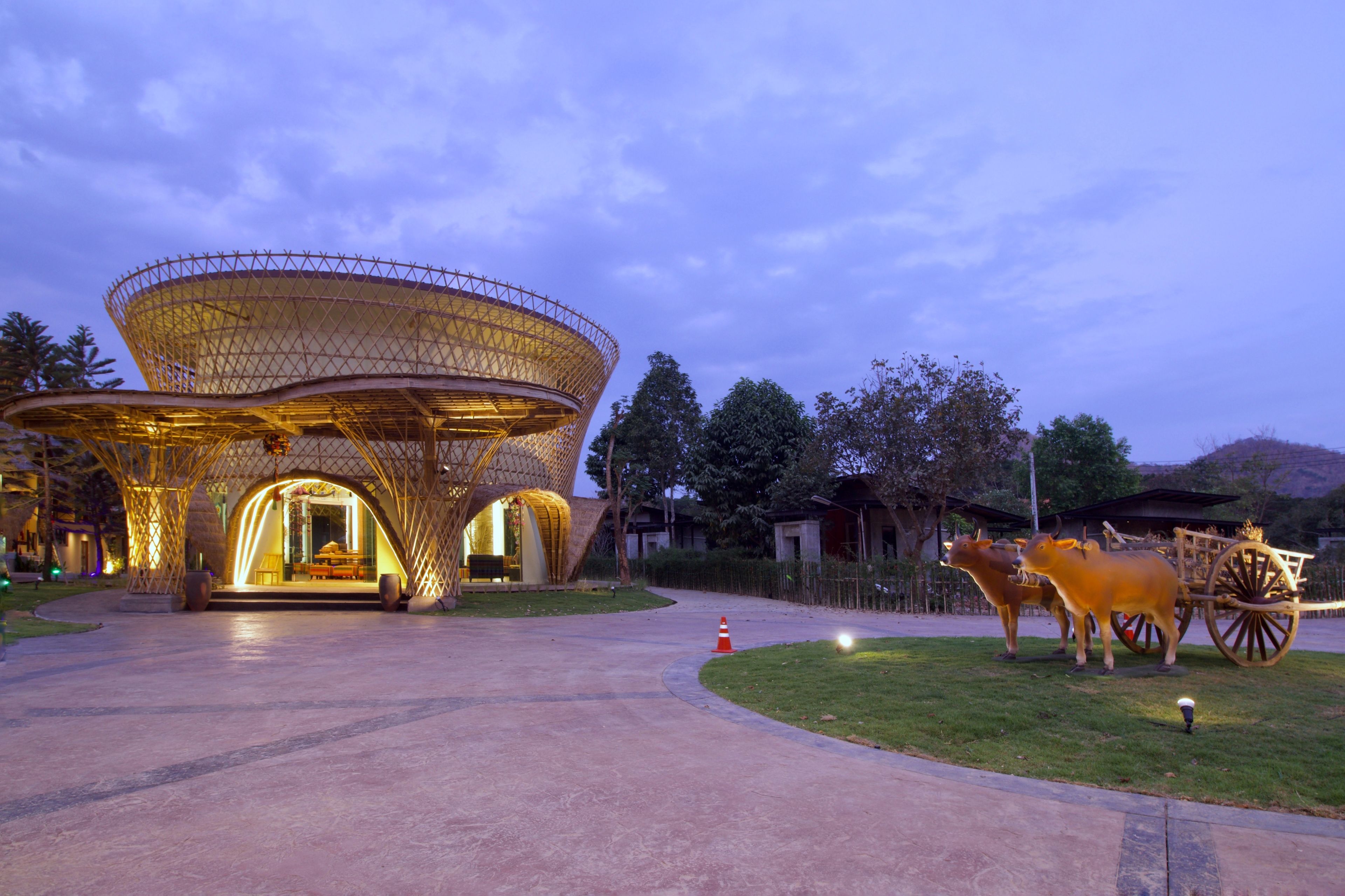 A large, open pavilion with a unique, lattice-like roof structure.