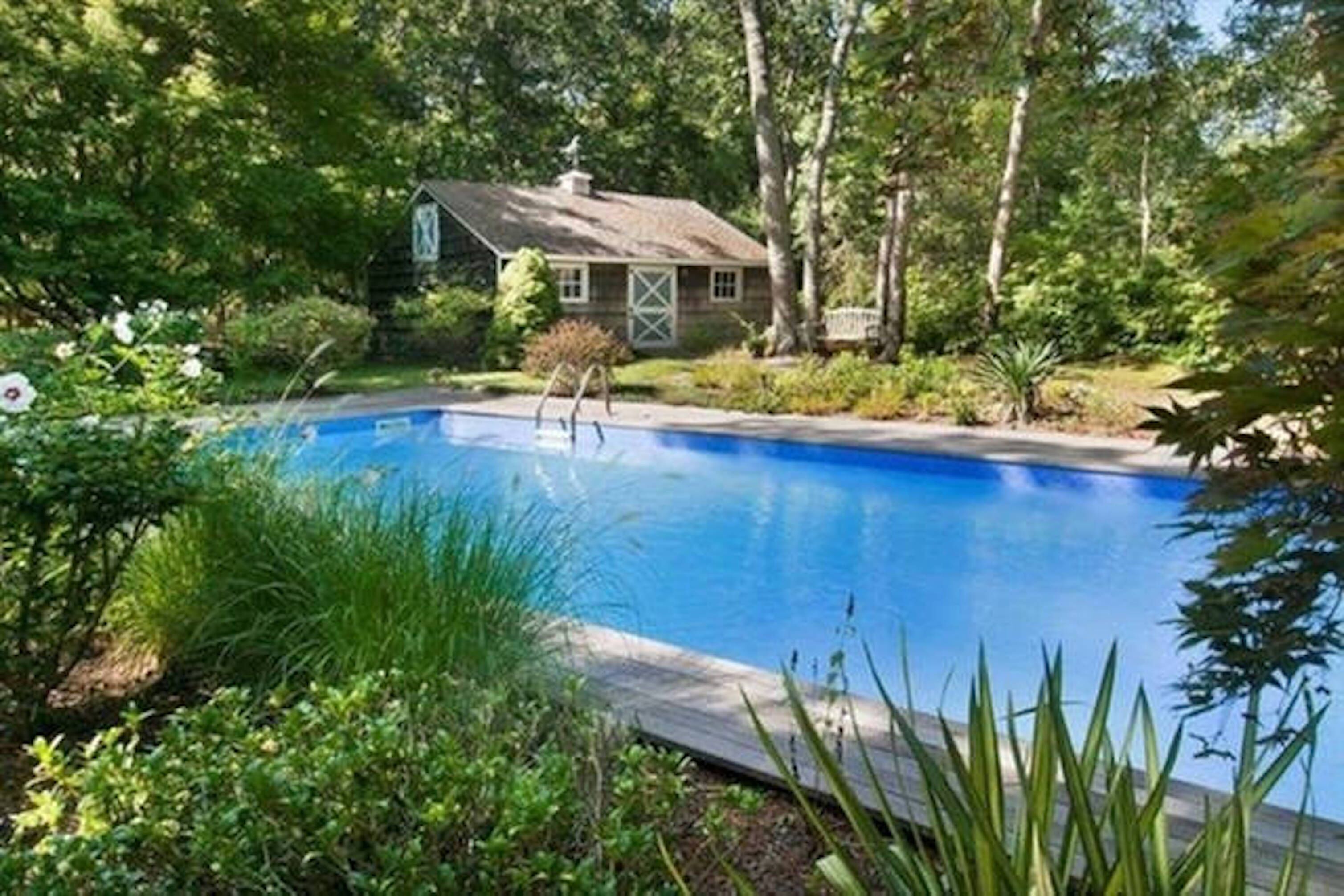 Heated pool with new liner.  Barn that was formerly used as a horse stable. 