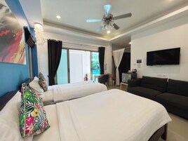 Habitación Deluxe con 2 camas individuales | Caja fuerte, escritorio, cortinas opacas y wifi gratis